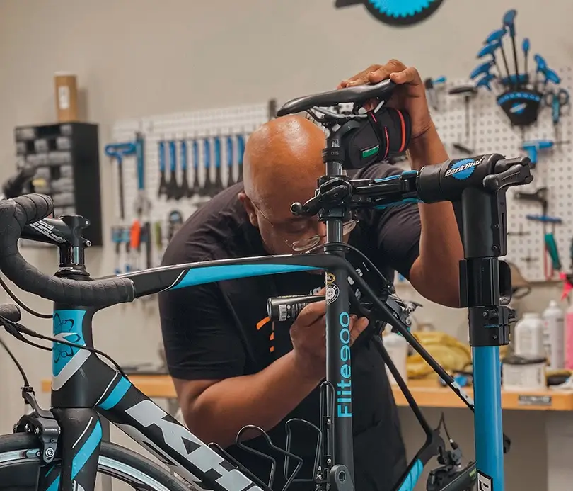 Big Wheel Bikes technician working on a bike